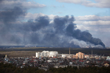 Smoke rising after shelling on the outskirts of the city is pictured from Kyiv
