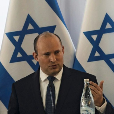 Israeli Prime Minister Naftali Bennett heads the weekly cabinet meeting in Kibbutz Mevo Hama in the Israeli-annexed Golan Heights
