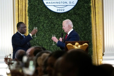 Senegal's President Macky Sall, Chairperson of the African Union, and US President Joe Biden make a toast during the US-African Leaders Summit dinner in the White House
